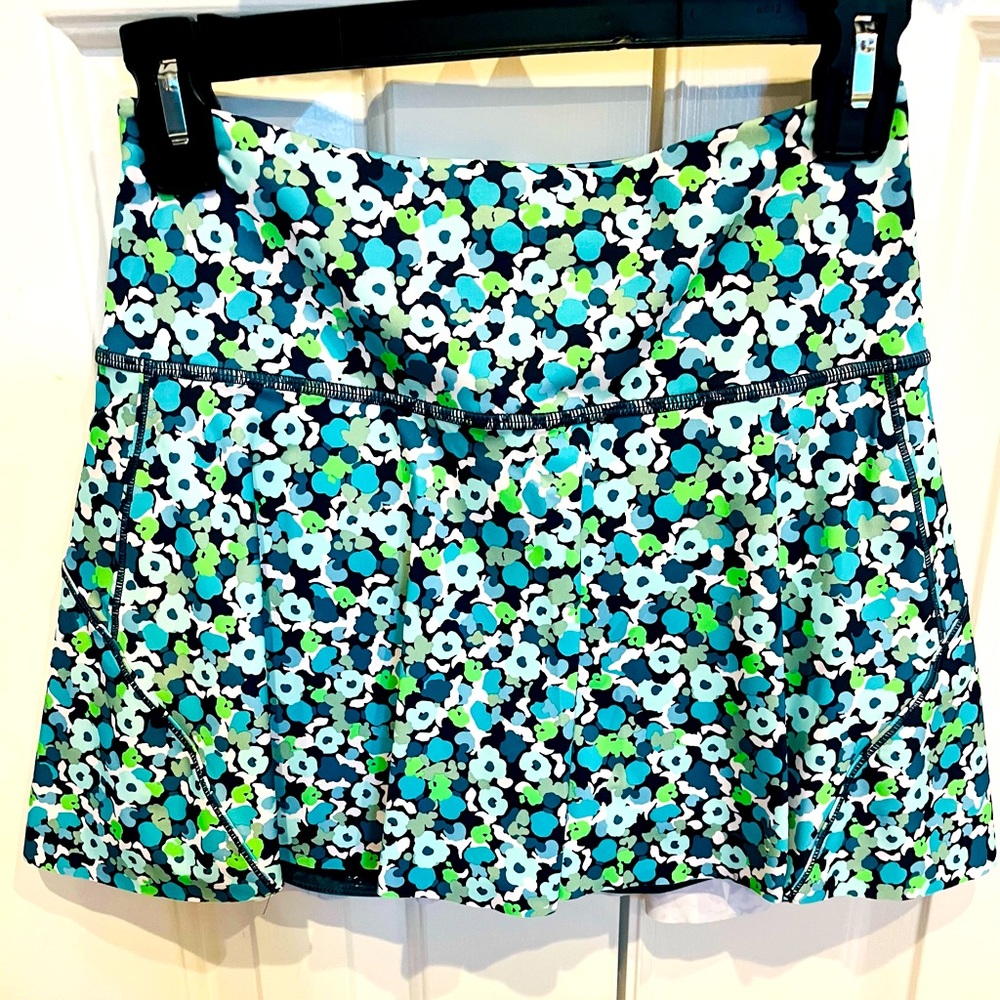 Athleta tennis/golf skirt. Size XS. Blue and green flower print